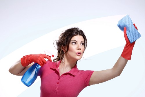 Local office cleaning team polishing reception and meeting areas
